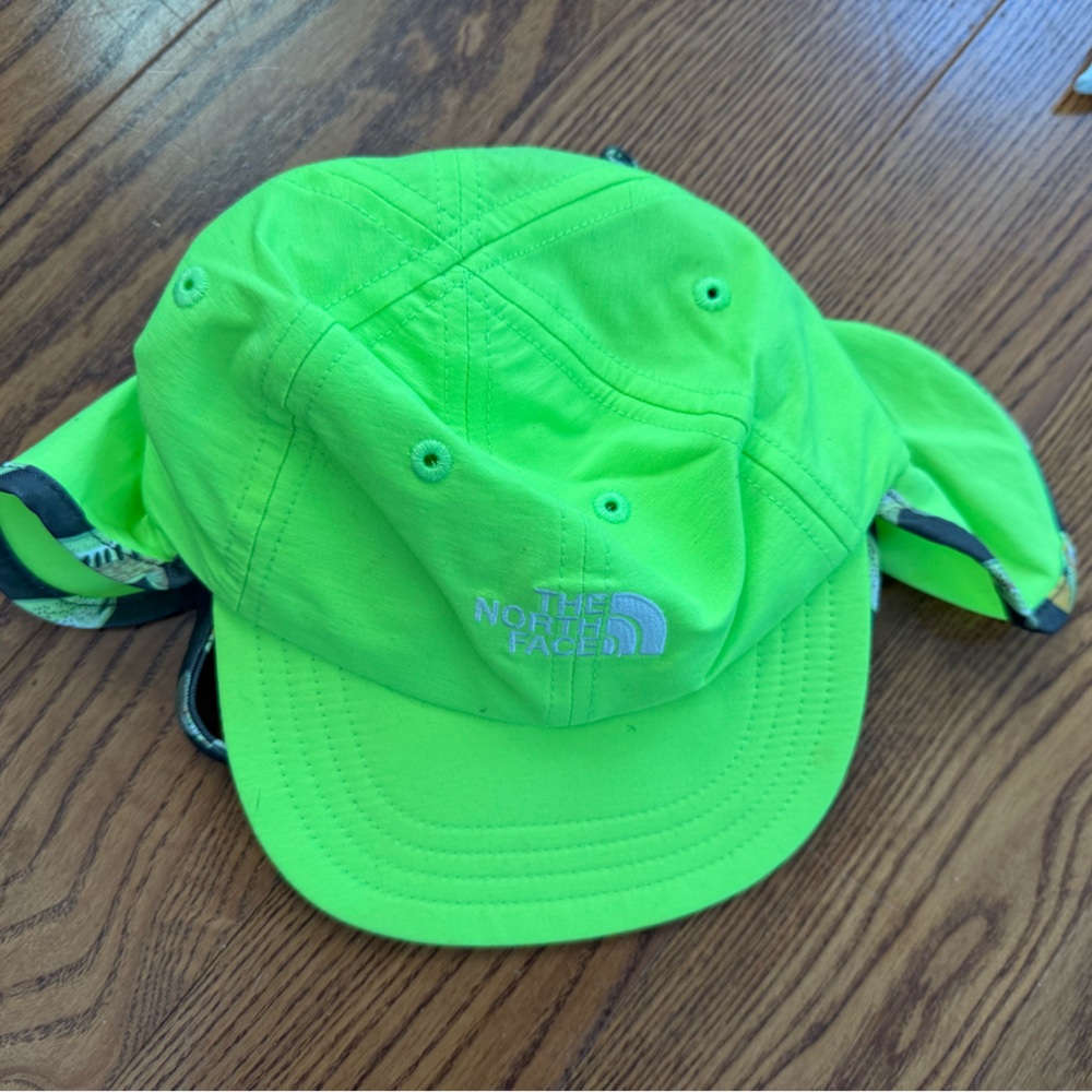 The North Face Class V Lil Sun Booster hat in safety green. Size 0-12mth